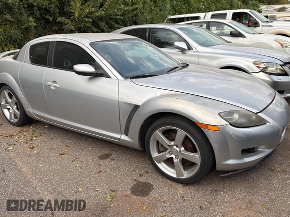 2004 Mazda RX-8 with VIN JM1FE17N540130784, listed as a Copart auction lot 76628734 with 122,806 mi miles and Clean Title. Bid and sale history available at DreamBid. Image 1.