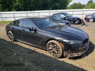 2023 BMW 8 Series M850i with VIN WBAGV8C09PCK80498, listed as a Copart auction lot 59668124 with 44,527 mi miles and Salvage Title. Bid and sale history available at carsss.com. Image 4.