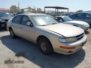 1999 Nissan Maxima GXE z VIN JN1CA21D1XM415860, wystawiony jako IAAI lot #42433524 z przebiegiem 173 522 mil mil oraz . Historia ofert i sprzedaży dostępna na DreamBid. Obrazek 1.