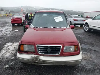 1996 Suzuki Sidekick z VIN JS3TD21V0T4107927, wystawiony jako IAAI lot #41249522 z przebiegiem 225 665 mil mil oraz . Historia ofert i sprzedaży dostępna na DreamBid. Obrazek 12.
