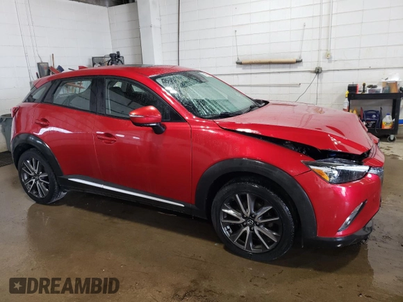 2017 Mazda CX-3 Grand Touring z VIN JM1DKFD70H0148182, wystawiony jako Copart lot #59032435 z przebiegiem 70 166 mil mil oraz Szkoda całkowita • Salvage title. Historia ofert i sprzedaży dostępna na DreamBid. Obrazek 4.