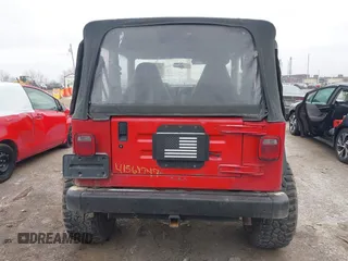 2002 Jeep Wrangler X z VIN 1J4FA39S52P708519, wystawiony jako IAAI lot #41569747 z przebiegiem 219 168 mil mil oraz . Historia ofert i sprzedaży dostępna na DreamBid. Obrazek 16.