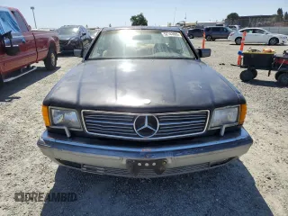 1987 Mercedes-Benz 560 with VIN WDBCA45D3HA358923, listed as a Copart auction lot 52143895 with 127,974 mi miles and Clean Title. Bid and sale history available at DreamBid. Image 5.