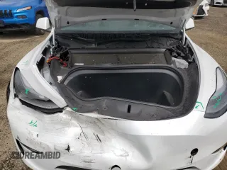 2023 Tesla Model Y Long Range z VIN 7SAYGAEE0PF693613, wystawiony jako Copart lot #54452895 z przebiegiem 19 574 mil mil oraz Szkoda całkowita • Salvage title. Historia ofert i sprzedaży dostępna na DreamBid. Obrazek 11.