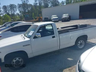 1991 Dodge Dakota S z VIN 1B7GL26XXMS302752, wystawiony jako IAAI lot #42060308 z przebiegiem 158 000 mil mil oraz . Historia ofert i sprzedaży dostępna na DreamBid. Obrazek 14.