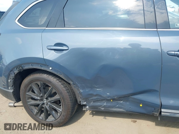 2021 Mazda CX-9 Carbon Edition z VIN JM3TCBDY0M0526352, wystawiony jako IAAI lot #42403901 z przebiegiem 50 193 mil mil oraz . Historia ofert i sprzedaży dostępna na DreamBid. Obrazek 6.