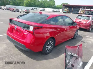 2021 Toyota Prius LE with VIN JTDL9MFU0M3029880, listed as a IAAI auction lot 42450003 with 91,558 mi miles and . Bid and sale history available at DreamBid. Image 4.