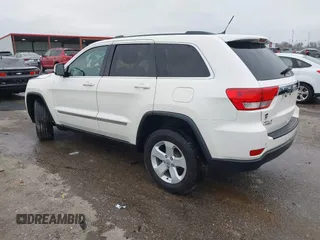 2012 Jeep Grand Cherokee Laredo with VIN 1C4RJFAG6CC297958, listed as a IAAI auction lot 40859811 with 213,499 mi miles. Bid and sale history available at carsss.com. Image 3.