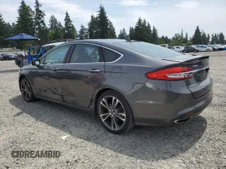 2017 Ford Fusion Titanium z VIN 3FA6P0K95HR139060, wystawiony jako Copart lot #62200755 z przebiegiem 106 133 mil mil oraz Szkoda całkowita • Salvage title. Historia ofert i sprzedaży dostępna na DreamBid. Obrazek 2.