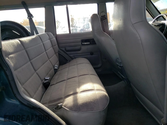 1996 Jeep Cherokee SE z VIN 1J4FJ28S6TL184205, wystawiony jako Copart lot #77558034 z przebiegiem 195 000 mil mil oraz Tytuł czysty. Historia ofert i sprzedaży dostępna na DreamBid. Obrazek 11.