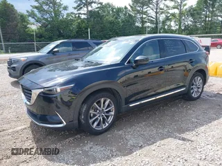2022 Mazda CX-9 Grand Touring with VIN JM3TCBDYXN0627657, listed as a IAAI auction lot 42498856 with 61,044 mi miles and . Bid and sale history available at DreamBid. Image 2.