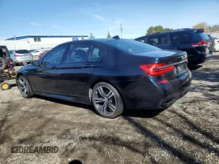 2017 BMW 7 Series 750i xDrive with VIN WBA7B0C55HG527032, listed as a Copart auction lot 52026415 with 67,722 mi miles and Clean title. Bid and sale history available at DreamBid. Image 2.