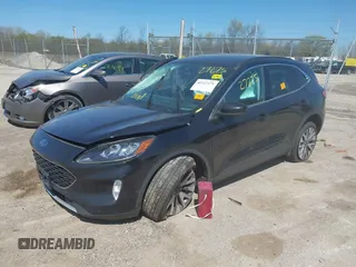 2021 Ford Escape Titanium with VIN 1FMCU9J95MUA77427, listed as a IAAI auction lot 42227275 with 75,079 mi miles and . Bid and sale history available at DreamBid. Image 2.