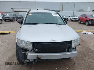 2011 Jeep Compass with VIN 1J4NT1FA7BD142600, listed as a IAAI auction lot 41590661 with 266,600 mi miles. Bid and sale history available at carsss.com. Image 13.