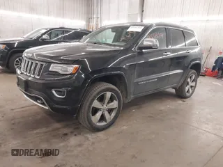 2014 Jeep Grand Cherokee Overland with VIN 1C4RJFCG8EC177899, listed as a IAAI auction lot 41695290 with 200,867 mi miles and . Bid and sale history available at DreamBid. Image 2.