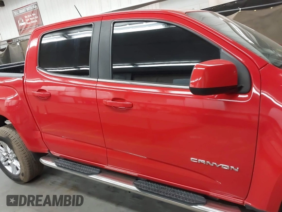 2019 GMC Canyon 2WD SLE z VIN 1GTG5CENXK1137028, wystawiony jako IAAI lot #42374821 z przebiegiem 91 228 mil mil oraz . Historia ofert i sprzedaży dostępna na DreamBid. Obrazek 13.