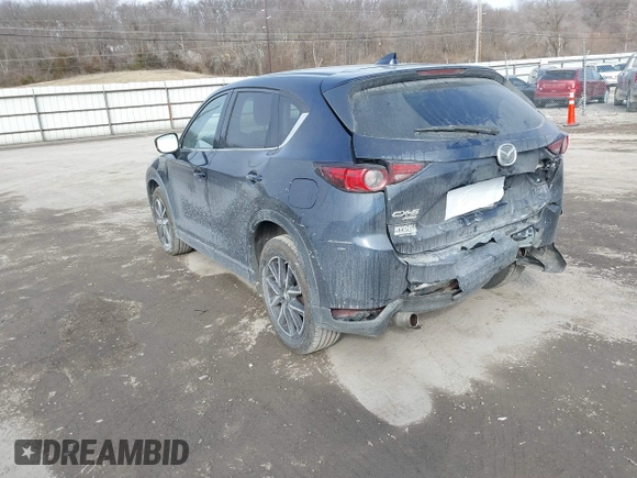 2018 Mazda CX-5 Grand Touring with VIN JM3KFBDM7J0338665, listed as a IAAI auction lot 41546019 with 141,740 mi miles. Bid and sale history available at carsss.com. Image 3.