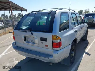 1998 Isuzu Rodeo S with VIN 4S2CM58WXW4325350, listed as a IAAI auction lot 42084411 with 292,784 mi miles. Bid and sale history available at carsss.com. Image 4.