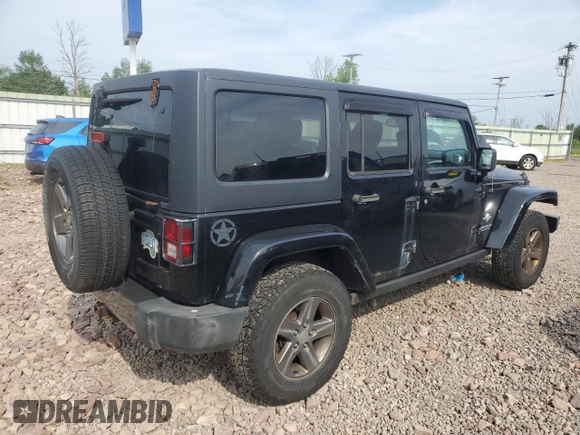 2015 Jeep Wrangler Unlimited Freedom with VIN 1C4BJWDG4FL568601, listed as a Copart auction lot 64041415 with 128,874 mi miles and Salvage title. Bid and sale history available at DreamBid. Image 3.