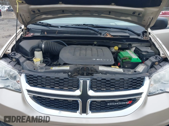 2012 Dodge Grand Caravan SE with VIN 2C4RDGBG4CR298996, listed as a IAAI auction lot 42133423 with 70,354 mi miles and . Bid and sale history available at DreamBid. Image 10.
