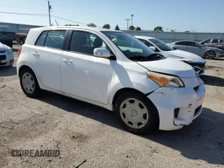 2009 Scion xD with VIN JTKKU10439J046749, listed as a Copart auction lot 60918345 with 126,995 mi miles and Salvage title. Bid and sale history available at DreamBid. Image 4.