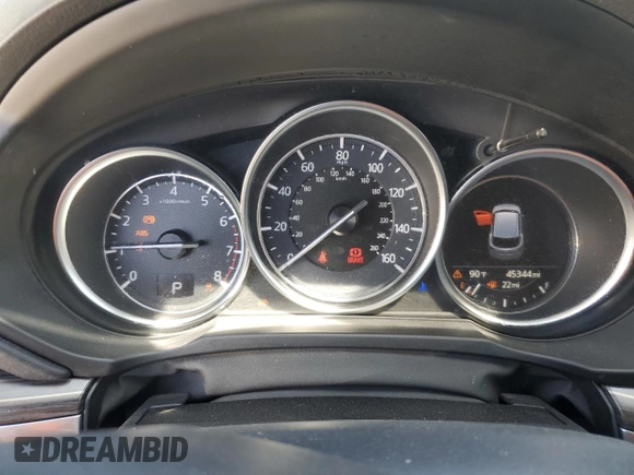 2018 Mazda CX-5 Grand Touring z VIN JM3KFBDM0J0399985, wystawiony jako Copart lot #54097665 z przebiegiem 45 344 mil mil oraz Szkoda całkowita • Salvage title. Historia ofert i sprzedaży dostępna na DreamBid. Obrazek 9.