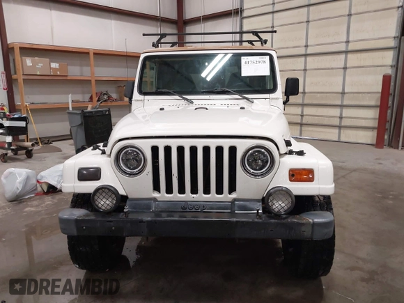 1997 Jeep Wrangler Sahara with VIN 1J4FY49S3VP529837, listed as a IAAI auction lot 41752978 with 138,024 mi miles. Bid and sale history available at carsss.com. Image 12.