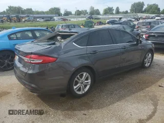 2018 Ford Fusion SE z VIN 3FA6P0H78JR261102, wystawiony jako Copart lot #69963883 z przebiegiem 120 068 mil mil oraz Czysty tytuł • Clean title. Historia ofert i sprzedaży dostępna na DreamBid. Obrazek 3.
