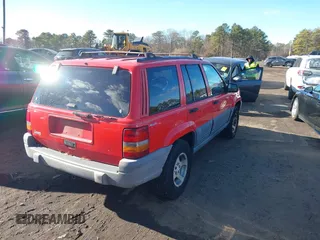 1997 Jeep Grand Cherokee Laredo with VIN 1J4GZ58S0VC550242, listed as a IAAI auction lot 41032114 with 185,307 mi miles. Bid and sale history available at carsss.com. Image 4.