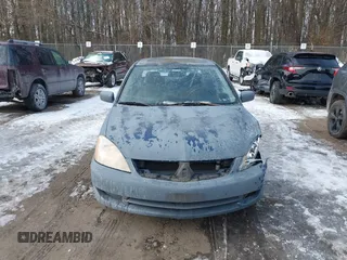 2006 Mitsubishi Lancer ES with VIN JA3AJ26E06U005019, listed as a IAAI auction lot 41381773 with 174,034 mi miles. Bid and sale history available at carsss.com. Image 12.