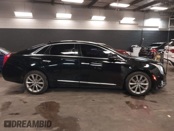 2013 Cadillac XTS Luxury z VIN 2G61R5S34D9102625, wystawiony jako IAAI lot #41668752 z przebiegiem 112 065 mil mil oraz . Historia ofert i sprzedaży dostępna na DreamBid. Obrazek 13.