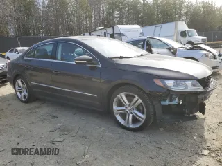 2015 Volkswagen CC Sport with VIN WVWBN7AN4FE814712, listed as a Copart auction lot 48027705 with 102,477 mi miles and Salvage Title. Bid and sale history available at DreamBid. Image 4.