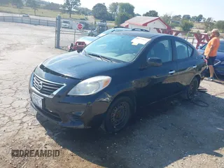 2014 Nissan Versa SV with VIN 3N1CN7AP2EL836604, listed as a IAAI auction lot 40574887 with 105,057 mi miles. Bid and sale history available at carsss.com. Image 2.