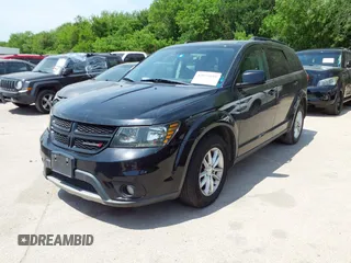 2015 Dodge Journey SXT with VIN 3C4PDCBG2FT718451, listed as a IAAI auction lot 42039821 with 198,695 mi miles and . Bid and sale history available at DreamBid. Image 2.