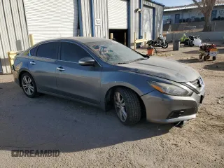 2016 Nissan Altima SL z VIN 1N4BL3AP1GC267661, wystawiony jako Copart lot #84277104 z przebiegiem 122 527 mil mil oraz Szkoda całkowita • Salvage title. Historia ofert i sprzedaży dostępna na DreamBid. Obrazek 4.