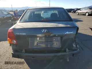 2005 Hyundai Accent GLS with VIN KMHCG45C95U665574, listed as a Copart auction lot 82603804 with 154,187 mi miles and Salvage Title. Bid and sale history available at carsss.com. Image 6.