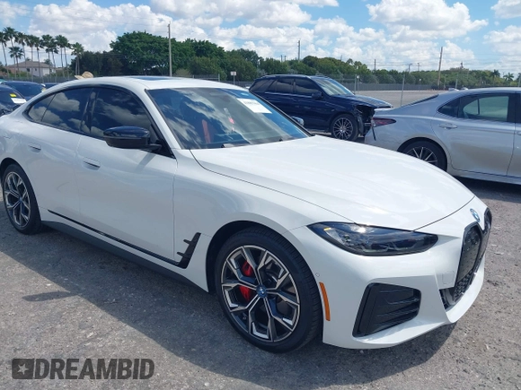 2024 BMW i4 eDrive35 z VIN WBY43AW02RFS79370, wystawiony jako IAAI lot #41887964 z przebiegiem 11 910 mil mil oraz . Historia ofert i sprzedaży dostępna na DreamBid. Obrazek 1.