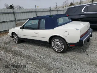 1987 Oldsmobile Toronado with VIN 1G3EZ1130HU307201, listed as a Copart auction lot 49290815 with 104,837 mi miles and Salvage Title. Bid and sale history available at DreamBid. Image 2.