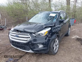 2019 Ford Escape Titanium with VIN 1FMCU9J91KUC42161, listed as a IAAI auction lot 41942122 with 100,677 mi miles and . Bid and sale history available at DreamBid. Image 17.