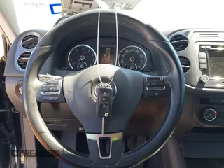2015 Volkswagen Tiguan SE with VIN WVGAV7AX1FW558855, listed as a IAAI auction lot 42064427 with 58,584 mi miles and . Bid and sale history available at DreamBid. Image 11.