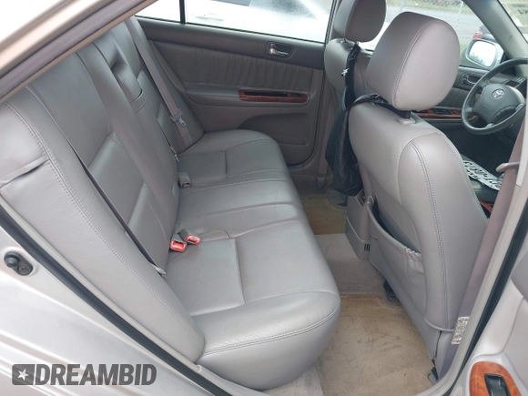 2006 Toyota Camry LE z VIN 4T1BF32K86U119208, wystawiony jako IAAI lot #42127284 z przebiegiem 99 864 mil mil oraz . Historia ofert i sprzedaży dostępna na DreamBid. Obrazek 8.