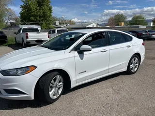 2018 Ford Fusion Hybrid SE with VIN 3FA6P0LU5JR173833, listed as a Copart auction lot 55092565 with 83,242 mi miles and Clean Title. Bid and sale history available at carsss.com. Image 2.