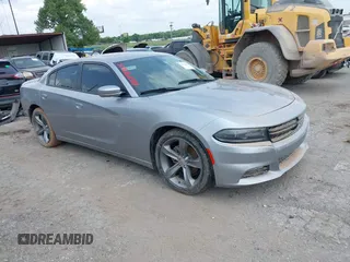 2015 Dodge Charger SXT with VIN 2C3CDXHG2FH768681, listed as a IAAI auction lot 39939245 with Not Provided miles and . Bid and sale history available at DreamBid. Image 1.