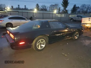 1990 Pontiac Firebird with VIN 1G2FS23TXLL205077, listed as a Copart auction lot 44035705 with 142,809 mi miles and Salvage title. Bid and sale history available at DreamBid. Image 3.
