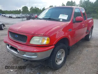 1997 Ford F-150 with VIN 1FTDX08W2VKC17809, listed as a IAAI auction lot 42541525 with 143,963 mi miles and . Bid and sale history available at DreamBid. Image 6.