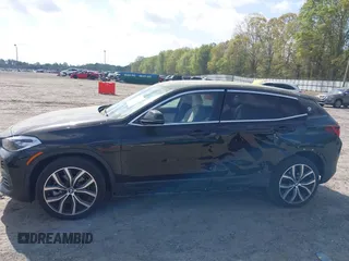 2022 BMW X2 sDrive28i z VIN WBXYH9C00N5U57853, wystawiony jako IAAI lot #41958326 z przebiegiem 49 518 mil mil oraz . Historia ofert i sprzedaży dostępna na DreamBid. Obrazek 14.