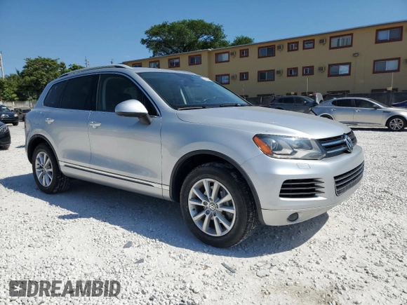 2014 Volkswagen Touareg Sport with VIN WVGEF9BP8ED005445, listed as a Copart auction lot 53694215 with 194,711 mi miles and Salvage Title. Bid and sale history available at DreamBid. Image 4.