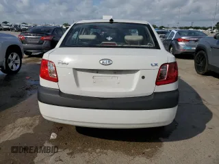 2009 Kia Rio LX with VIN KNADE223X96439445, listed as a Copart auction lot 54619335 with 102,120 mi miles and Salvage Title. Bid and sale history available at DreamBid. Image 6.