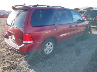 2005 Ford Freestar Wagon SES with VIN 2FMZA57645BA50977, listed as a IAAI auction lot 41540023 with 149,319 mi miles. Bid and sale history available at carsss.com. Image 4.