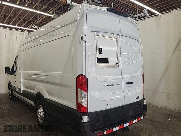 2023 Ford Transit Cargo with VIN 1FTBW3U84PKB20116, listed as a IAAI auction lot 42748031 with 6,591 mi miles and . Bid and sale history available at DreamBid. Image 6.